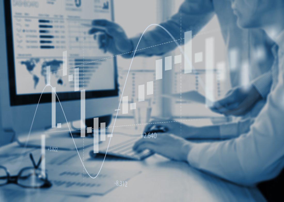 Abstract finance concept with people discussing financial data on a business analytics dashboard on computer screen in background and stock market investment chart in foreground